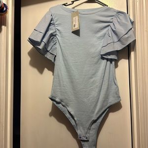 ight blue ruffle sleeved body suit